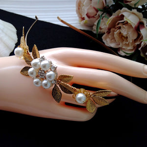 serre-tête floral avec perles et feuilles dorées pour coiffure de mariage