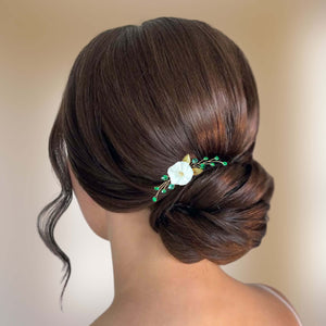 épingle à cheveux avec cristaux émeraude, feuilles dorées et fleur blanche en argile polymère pour coiffure de mariage ou soirée