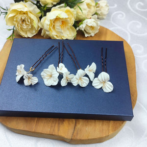 Lot de 4 épingles à chignon fleurs blanches en porcelaine froide pour chignon ou coiffure de mariage